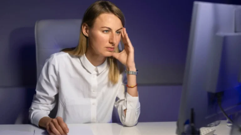 fiduciary Concerned woman reviews fiduciary responsibility policy for PBM services on computer.
