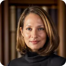 Headshot of Amy Gasbarro, professional woman with shoulder-length highlighted hair, wearing a black turtleneck.