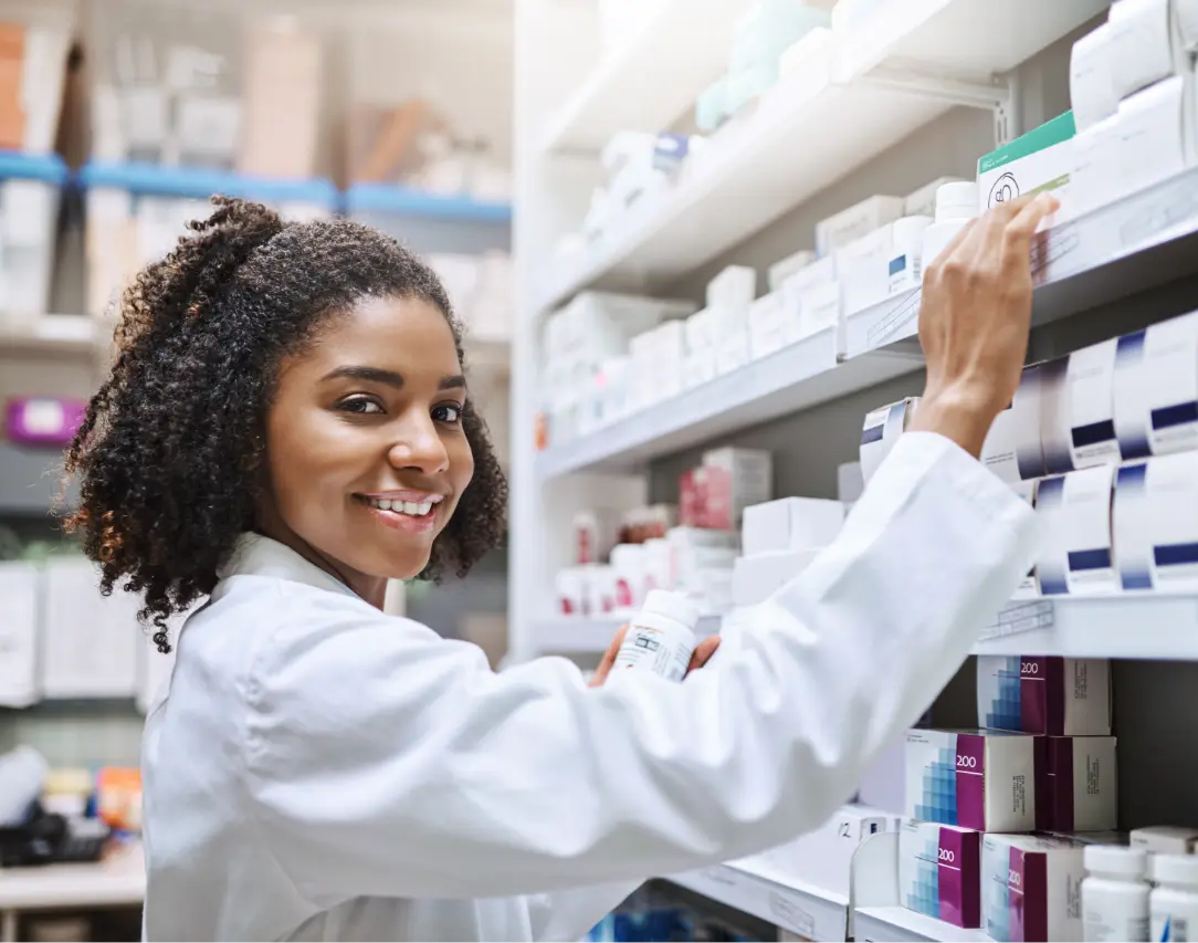 elmcrx-prior-autorization-hero-banner-1 Pharmacist reaching for medication on shelves. Prior authorization services.