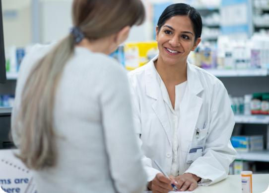 pbm-banner Pharmacist assisting a customer. PBMs help manage prescription drug benefits, lowering costs and improving patient outcomes.